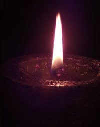 burning-candle-against-black-background-2022-01-12-12-19-03-utc